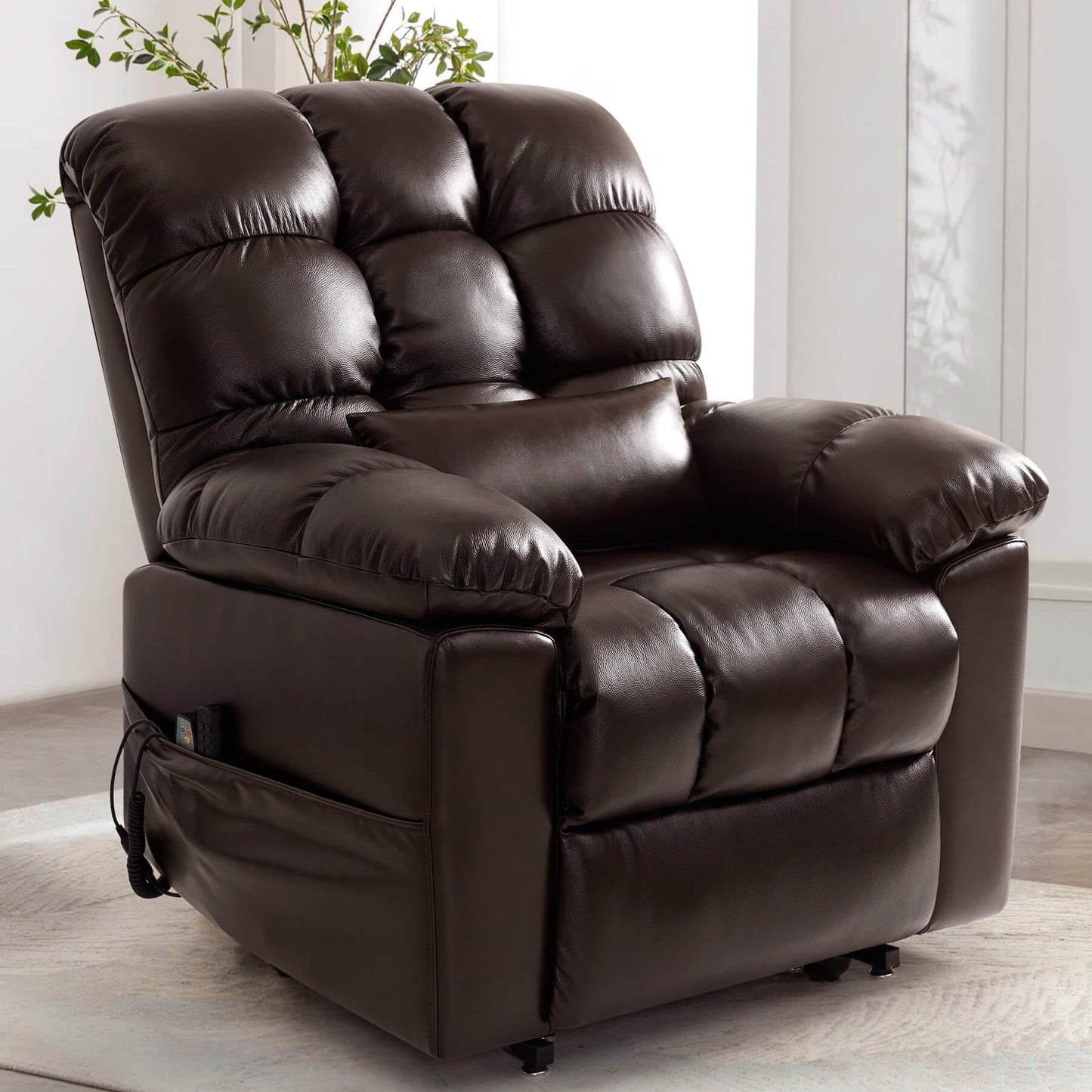 Sitting position brown leather power lift chair with lumbar pillow.