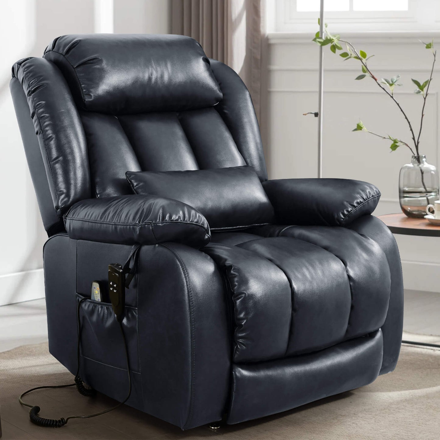 Navy blue leather recliner chair in a living room setting, facing sideways.